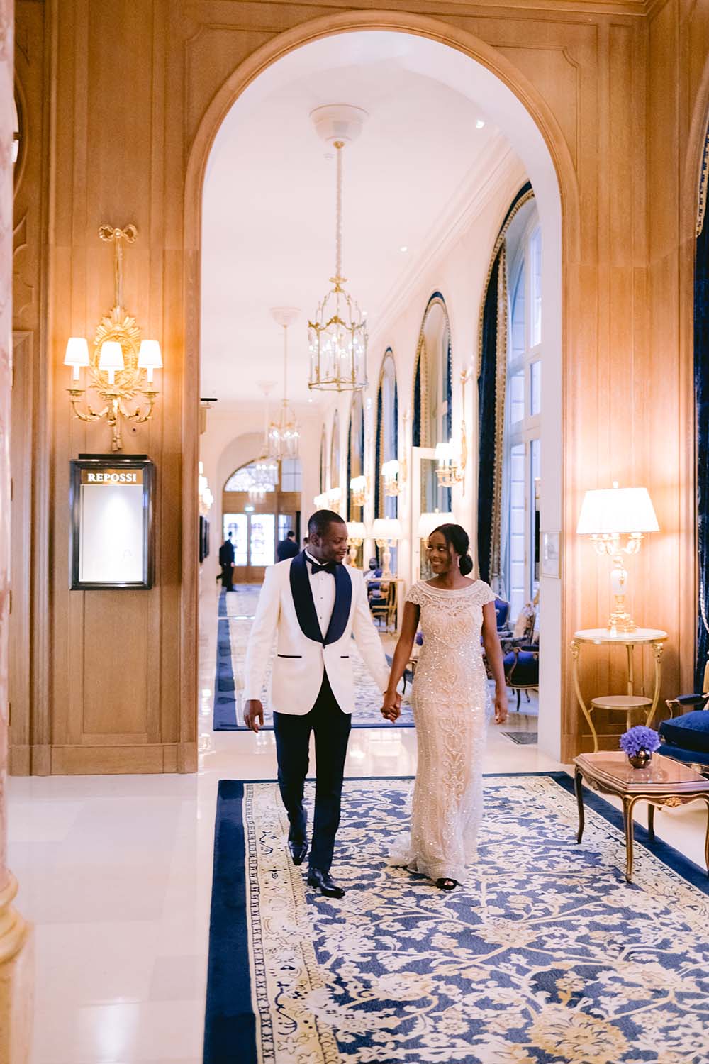 bride and groom in the hall of the ritz